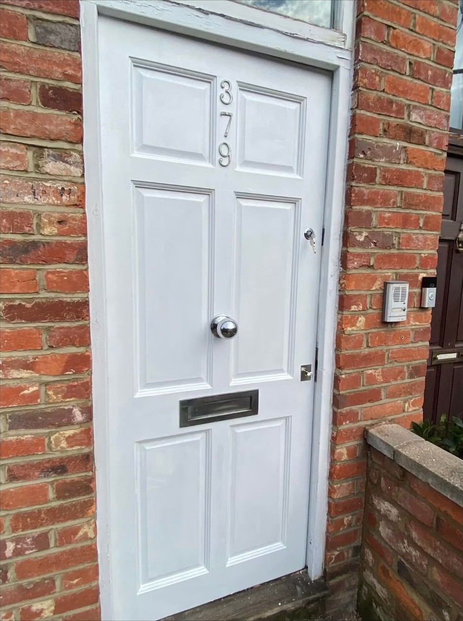 Front door repaired and re-secured after a burglary in London