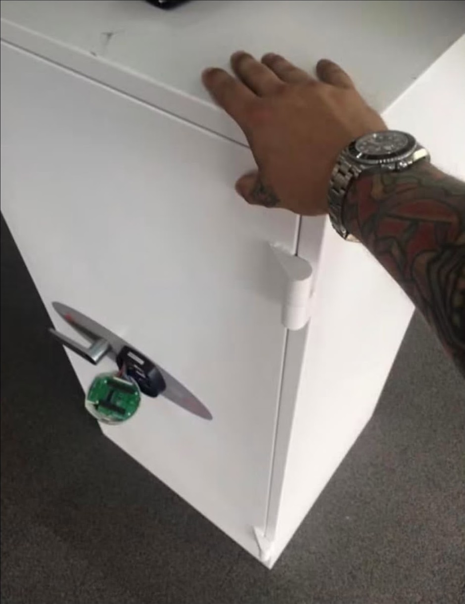 Electronic safe lock panel removed to expose wiring during a London safe opening