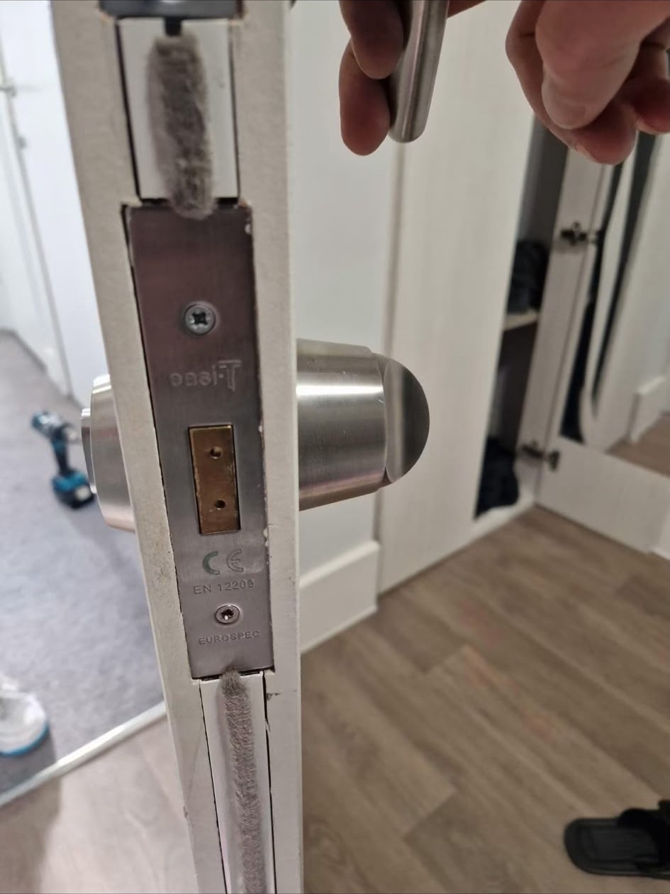 New euro cylinder lock fitted to a white uPVC door during a London lock change